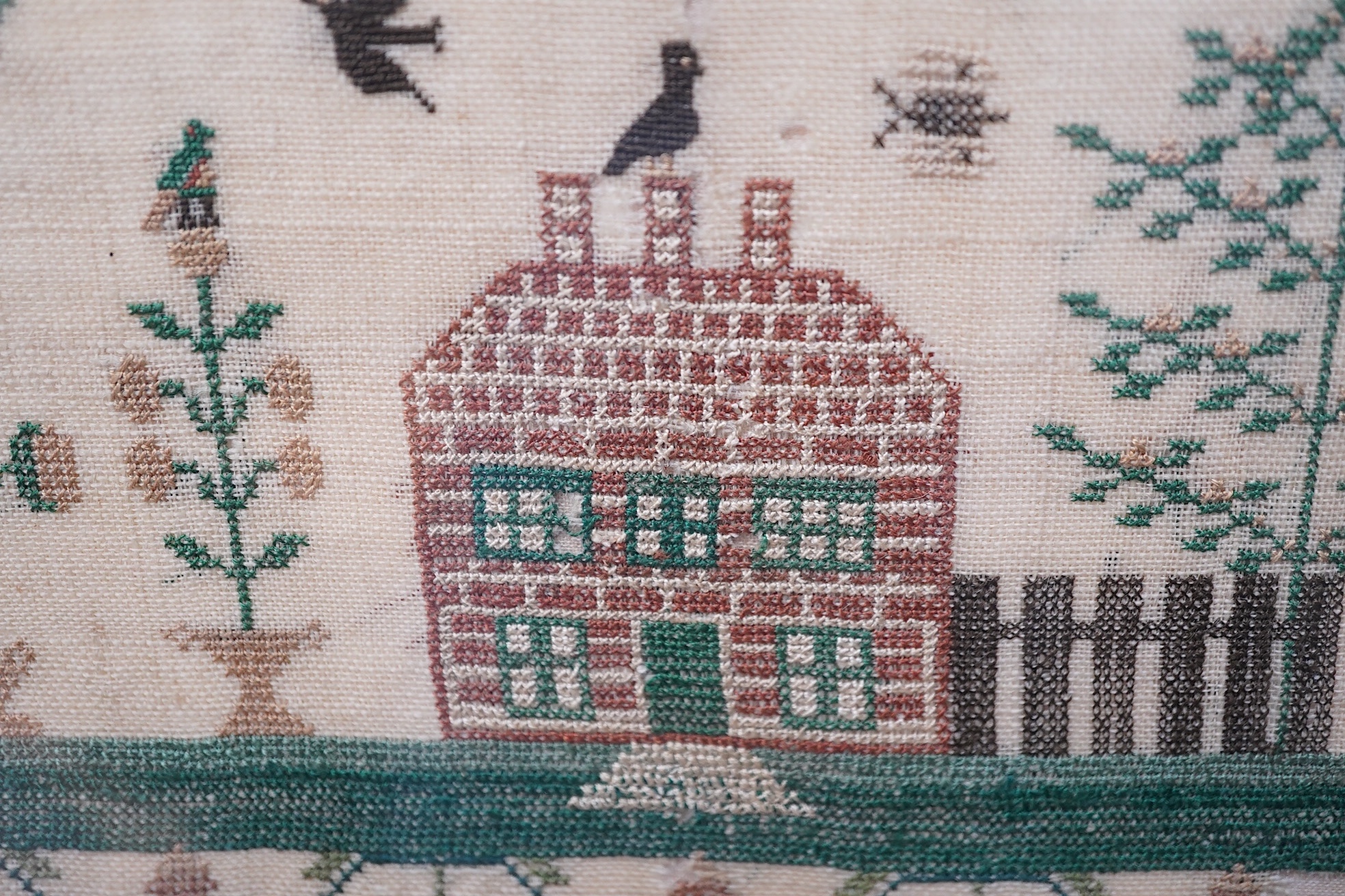 Two mid 19th century samplers worked by Elizabeth White, one dated 1842 aged 8 years, the other 1844 aged 11 years, both worked with a country scene of a house, birds, dogs and trees, the earlier sampler with a top panel